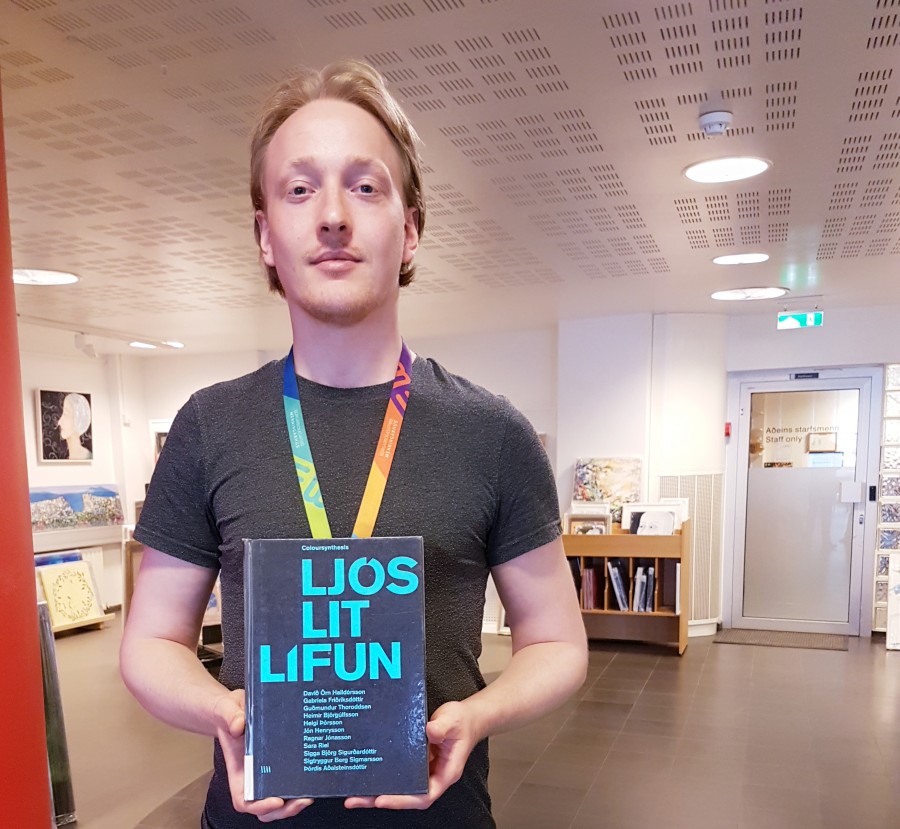 Librarian holding an art book