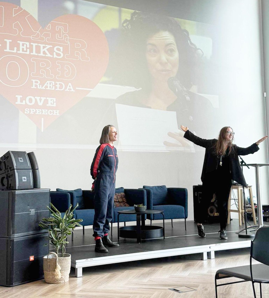 two women presenting the love speech project